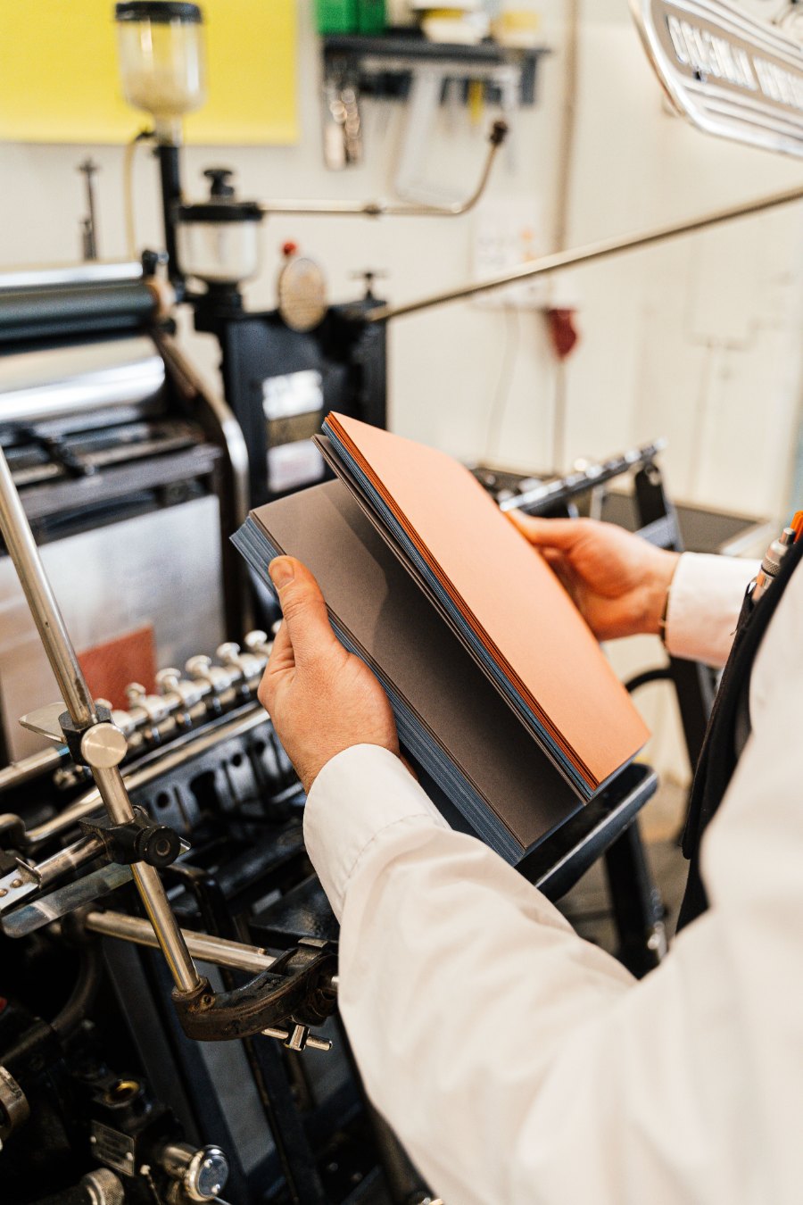 A Printworks operator loading coloured stock onto the press