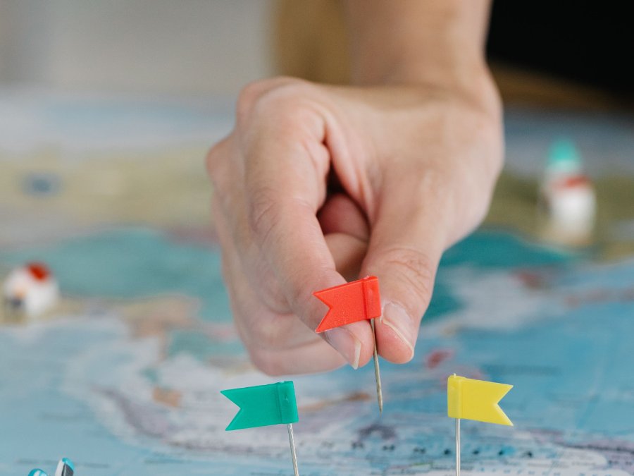 Flag pins marking several locations on a map